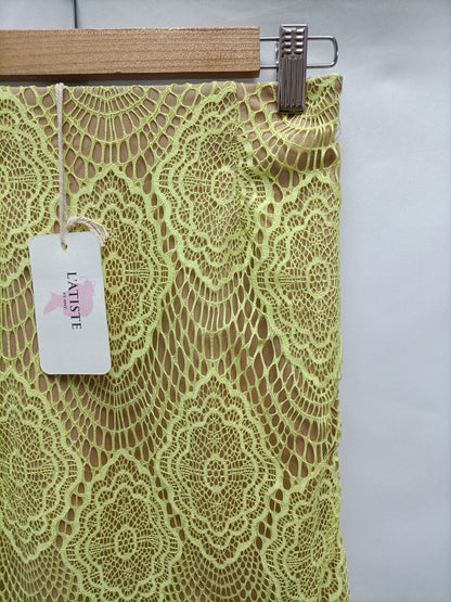 L'ATISTE. Yellow lace skirt Ts