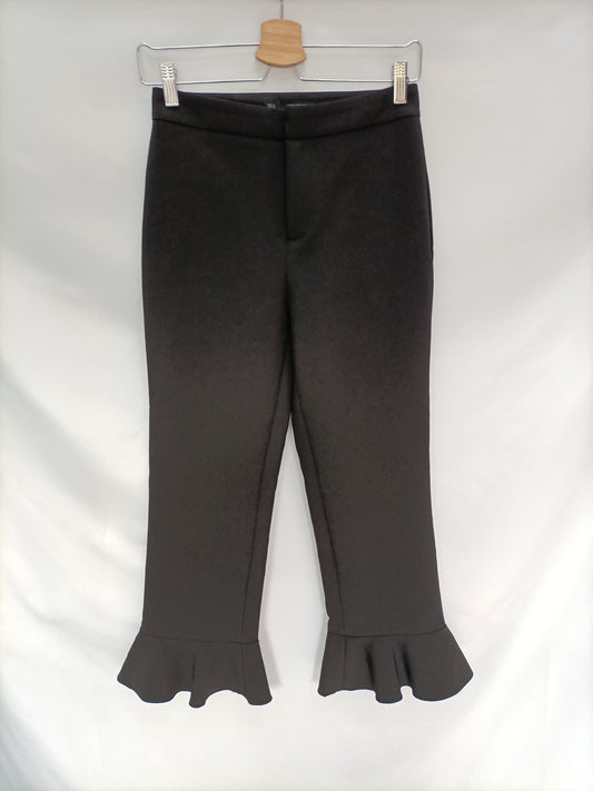 SFERA. Pantalón negro volante T.s