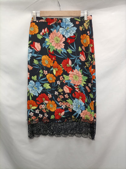 LICENCIA POÉTICA. Falda midi flores T.38