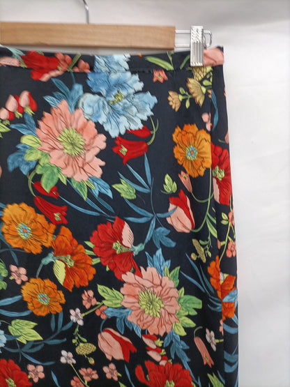 LICENCIA POÉTICA. Falda midi flores T.38