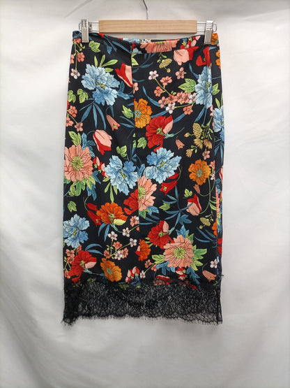 LICENCIA POÉTICA. Falda midi flores T.38