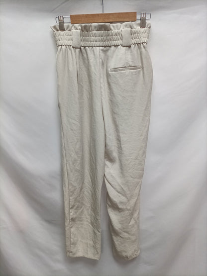 ZARA. Pantalón fluido beige T.s