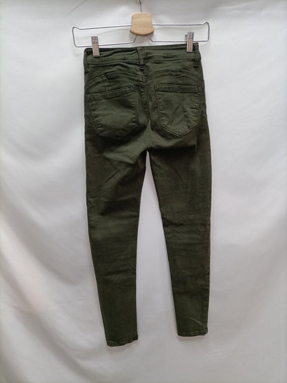 OTHERS. Green skinny pants size 34