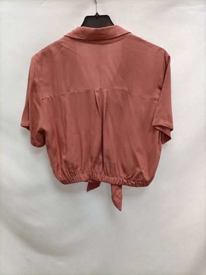 PULL&BEAR. Blusa rosa nudo