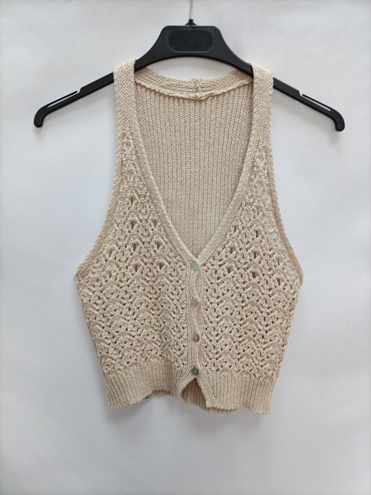 OTRAS. Chaleco beige troqueladoT.u(s)