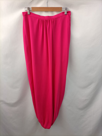 DAVID CHRISTIAN. Long pink skirt/trousers, size 40