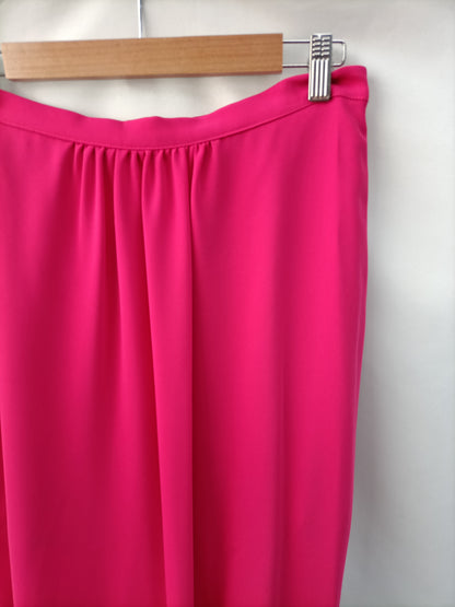 DAVID CHRISTIAN. Long pink skirt/trousers, size 40