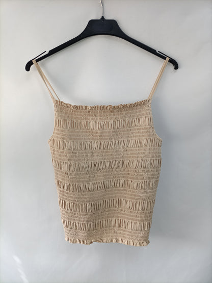 H&M. Top beige nido abeja T.m