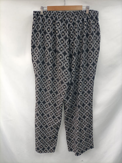 CALVIN KLEIN. Flowy printed trousers. Size 50