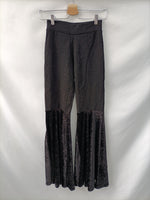 OTRAS. Pantalón negro textura T.s