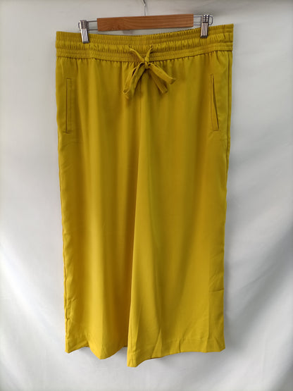 ZARA. Pantalón culotte mostaza T.xl
