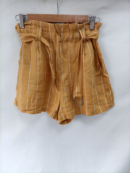 BERSHKA. Pantalón mostaza rayas T.m