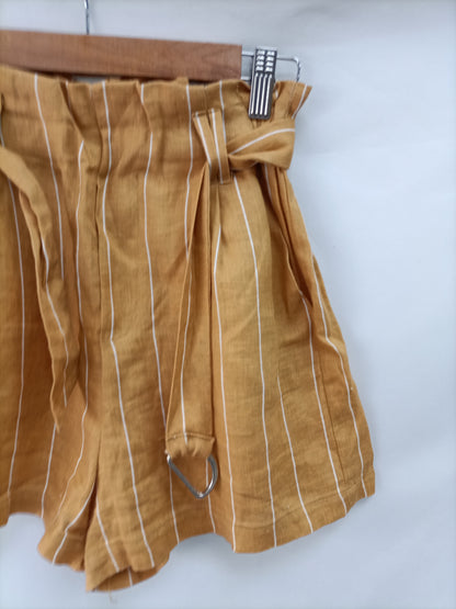 BERSHKA. Pantalón mostaza rayas T.m