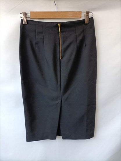 ZARA. falda negra tubo cremallera dorada T.xs
