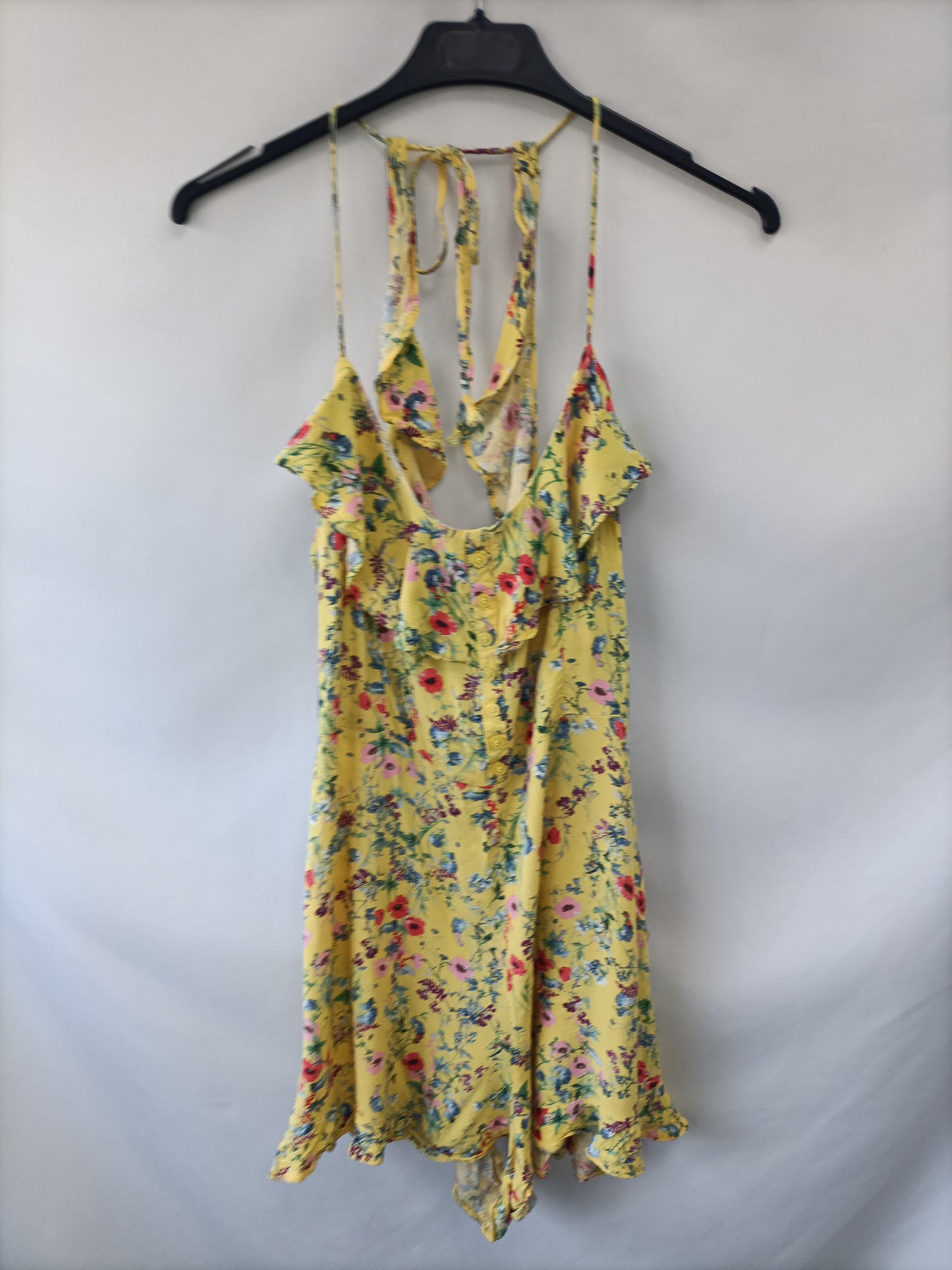 BERSHKA. Mono amarillo flores  T.m