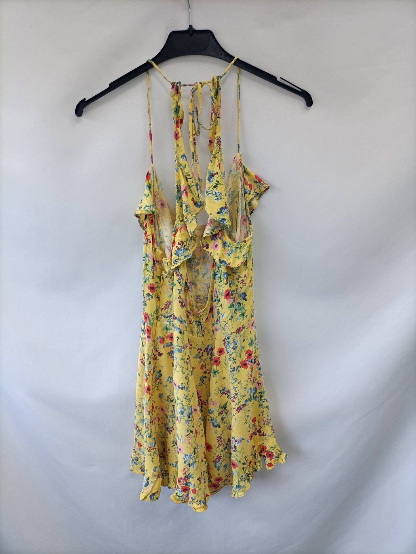 BERSHKA. Mono amarillo flores  T.m