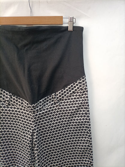 H&M. Pantalón premamá estampado