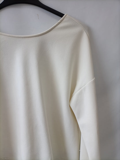 OTRAS. Camiseta beige elástica Tu