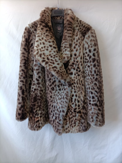ZARA. Abrigo animal print T.s