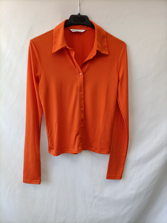 STRADIVARIUS. Too naranja abotonado T.s