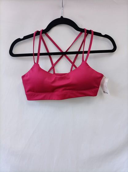 ACTANDBE. Top Deportivo rosa T.s