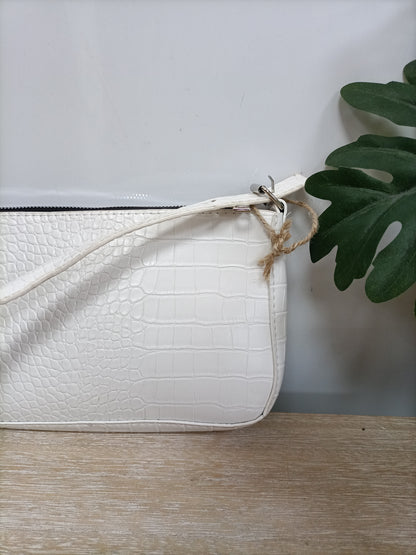 OTRAS. Bolso efecto serpiente