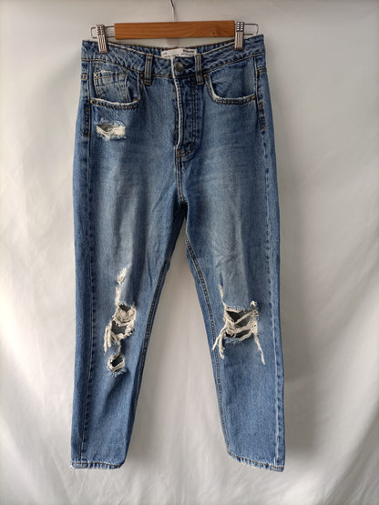 STRADIVARIUS. Pantalón recto rotos T. 36