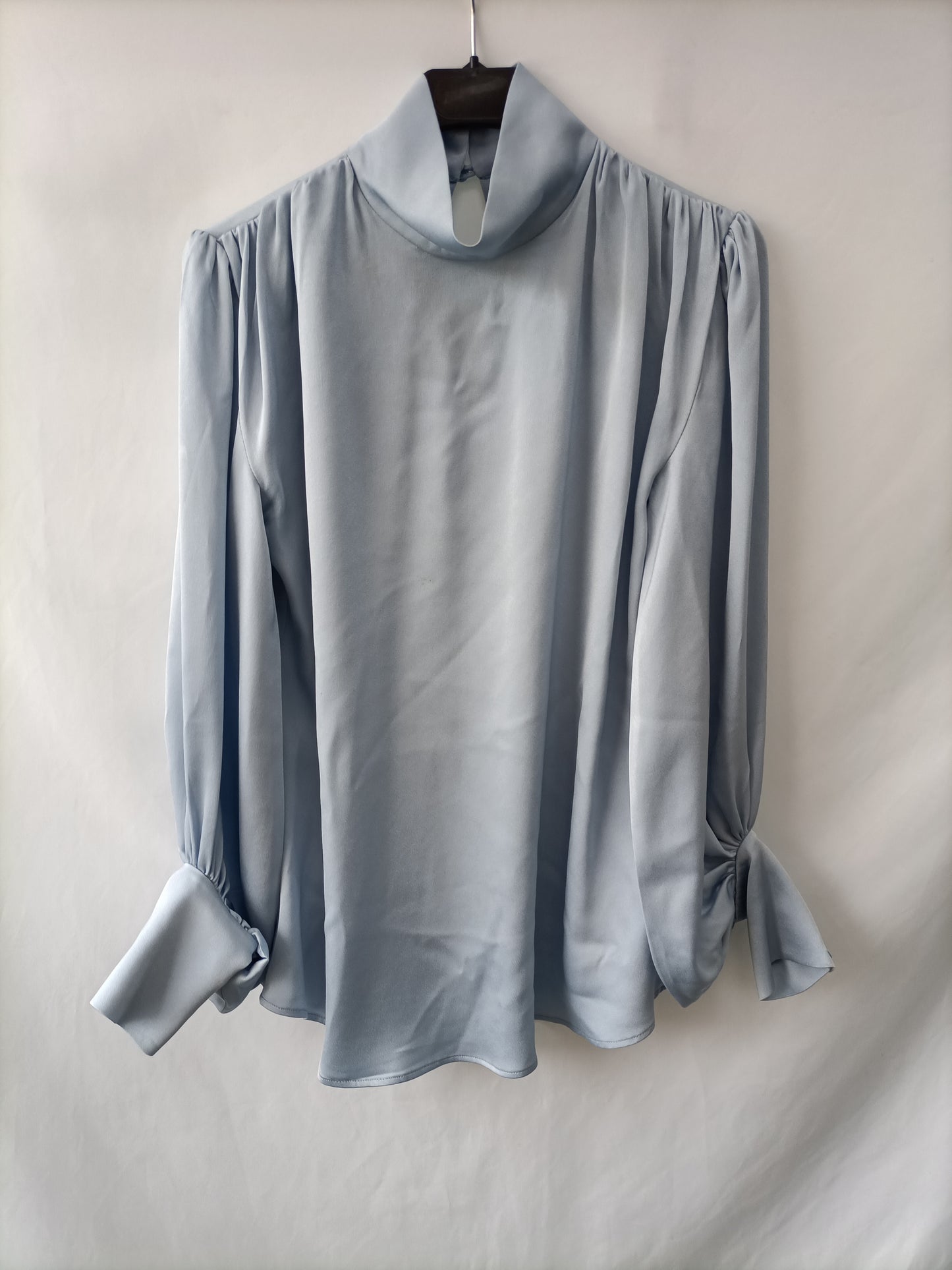 YOU LOOK AWESOME.Sky blue satin blouse Ts