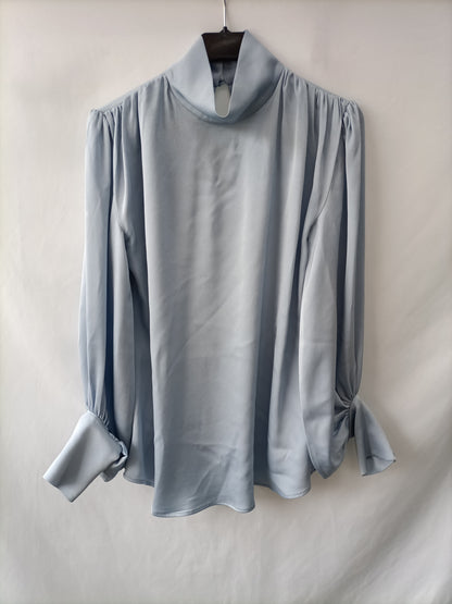 YOU LOOK AWESOME.Sky blue satin blouse Ts
