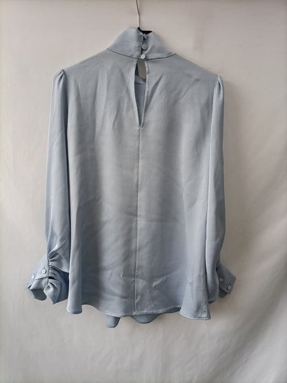 YOU LOOK AWESOME.Sky blue satin blouse Ts