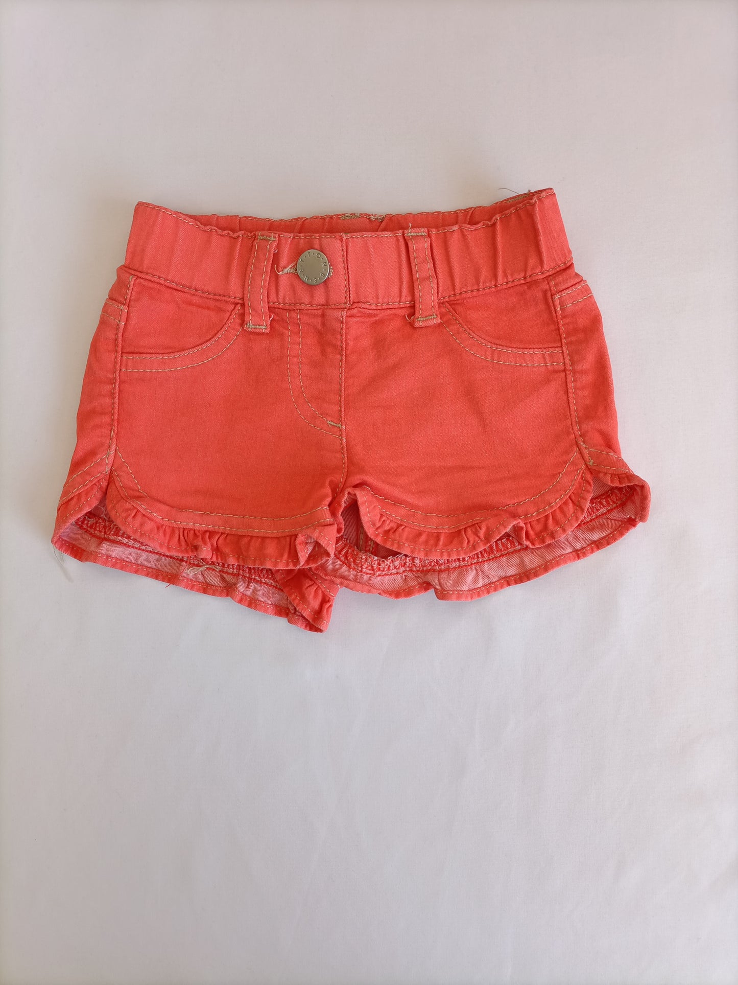 BENETTON. Orange shorts, size 1 year