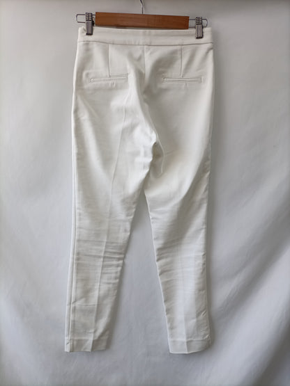 STRADIVARIUS. White skinny trousers, size 36