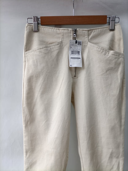 MANGO. Pantalón pitillo beige T.34