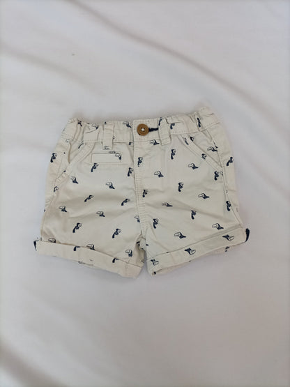 KIABI. Pantalón beige pajaros T.6 meses