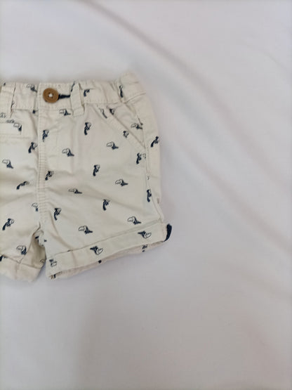 KIABI. Pantalón beige pajaros T.6 meses