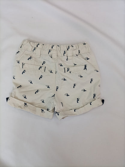 KIABI. Pantalón beige pajaros T.6 meses