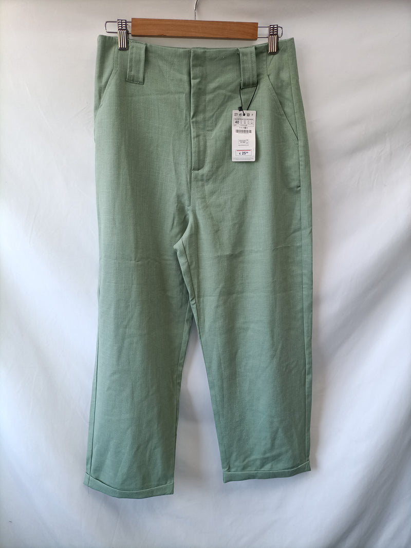 STRADIVARIUS.Pantalones anchos verde pastel T.40
