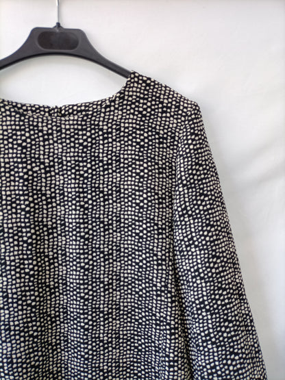 SFERA. Vestido negro con topos blancos. T.s