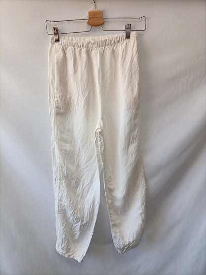OYSHO.Pantalones fluidos blancos T.XS