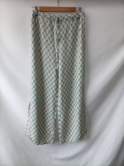 OTRAS. Pantalón fluido estampado Tu(s)