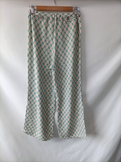 OTRAS. Pantalón fluido estampado Tu(s)