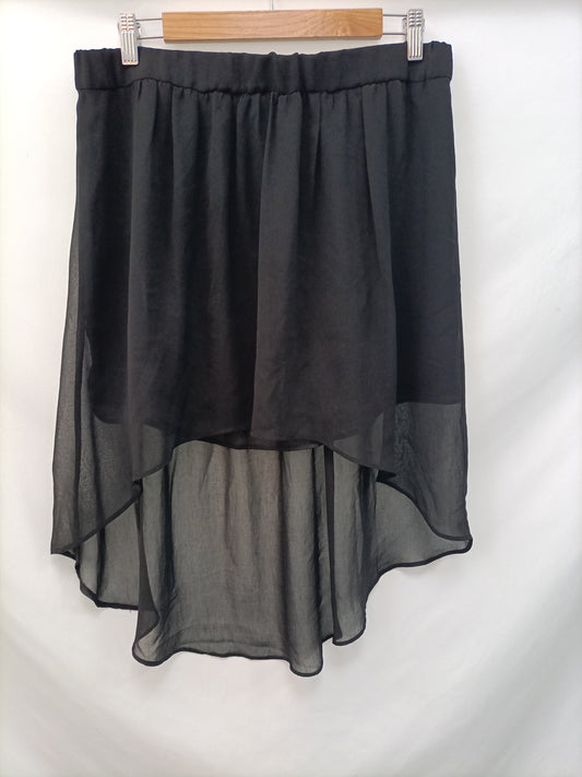 MANGO. Tl asymmetric black skirt