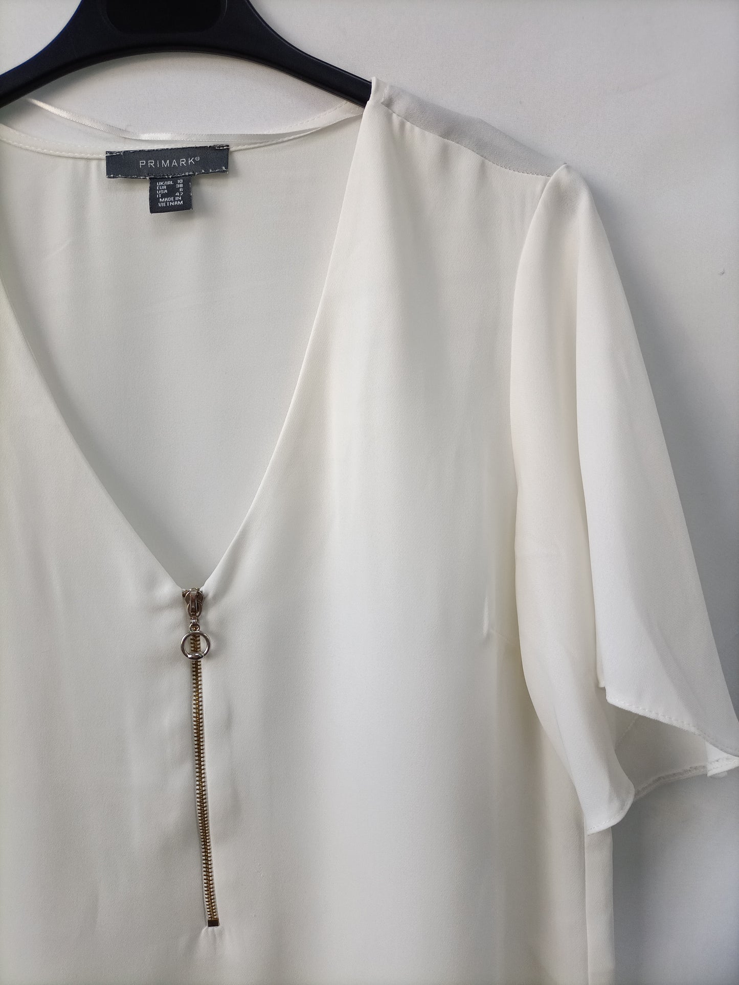 PRIMARK. White zip-up blouse, size 38