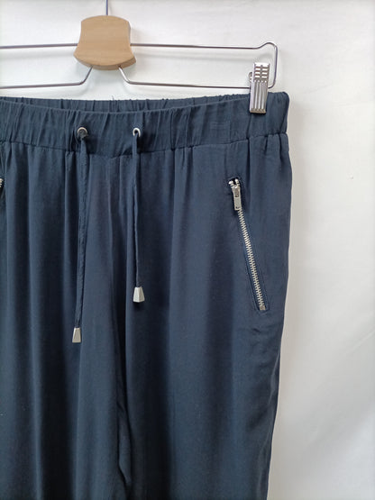 C&A. Pantalón Fluido azul T.s