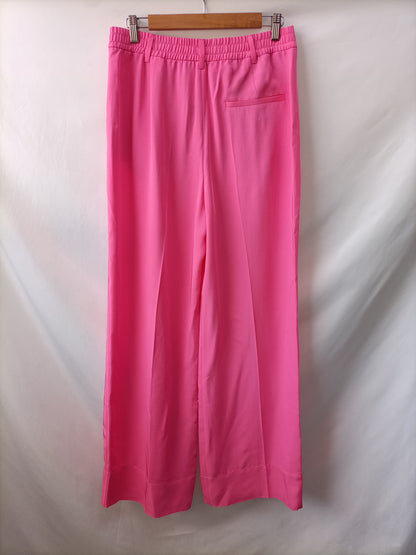 ZARA. Pantalón rosa Fluido T.m