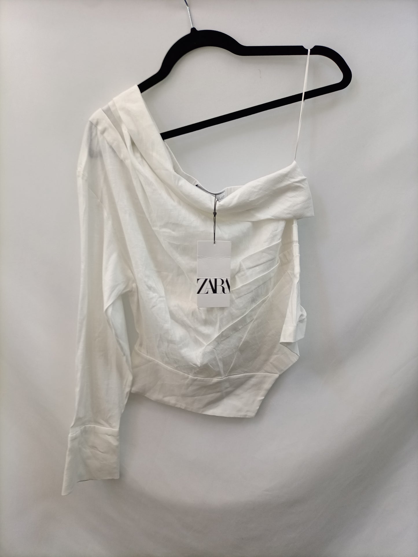 ZARA. Blusa blanca asimetrica T.l