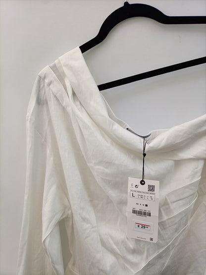 ZARA. Blusa blanca asimetrica T.l