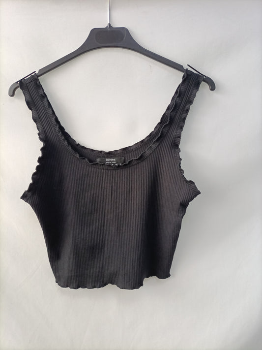 BERSHKA. Top canalé negro T.m