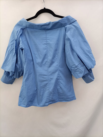 ZARA.Blusa azul mangas abullonadas T.s (tara)