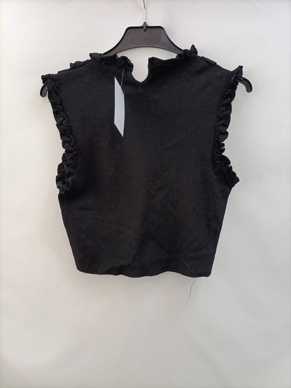 OTRAS.Top elástico ajustado volantes T.xs/s